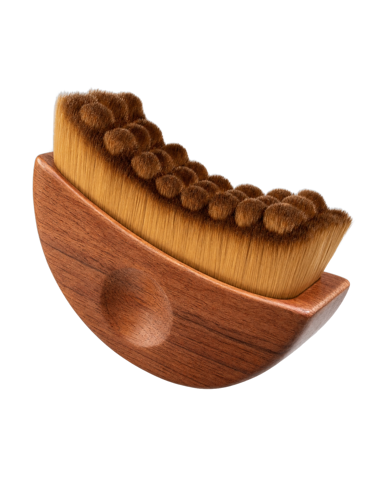 The Velynie brush at an angle, walnut crescent handle and ultra-soft contoured bristles, on a transparent background